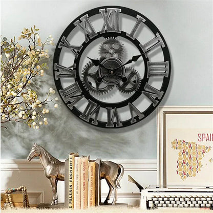 Large gear wall clock - Bevington, featuring an open-face design with exposed gears and oversized Roman numerals, mounted above a vintage-industrial display with horse bookends, a typewriter, and decor accents.