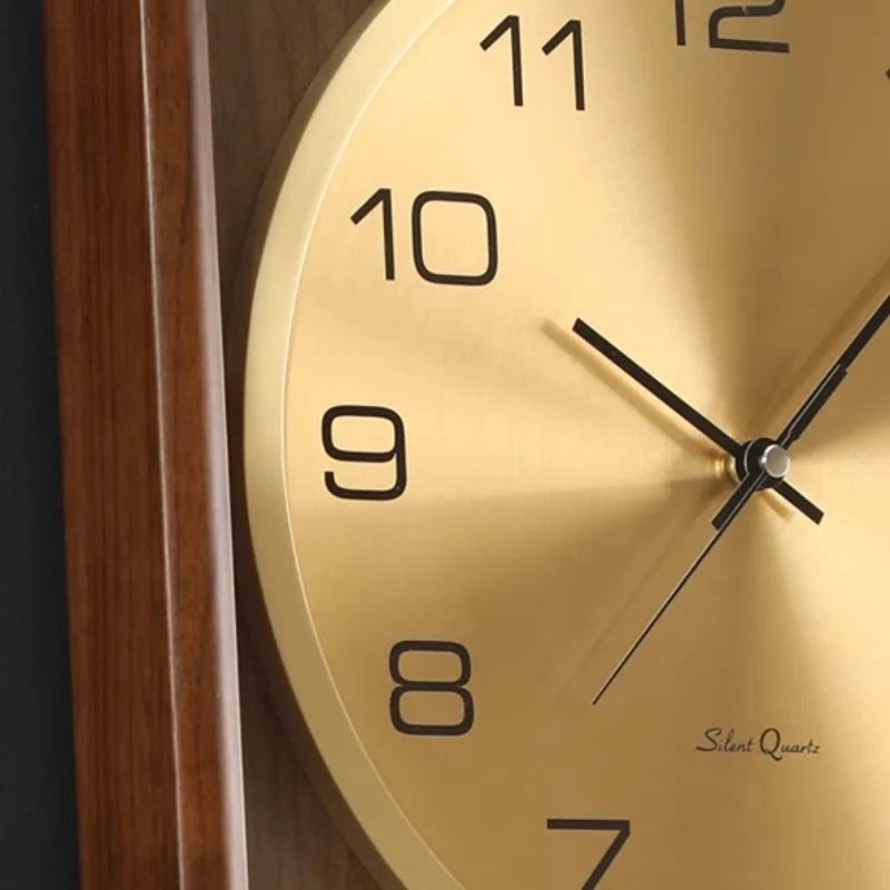 Wood Analog Wall Clock - Eastley featuring a brushed-gold dial with black numerals, simple black hands, and a wooden frame, embodies classic elegance, ideal for timeless recognition or decoration.