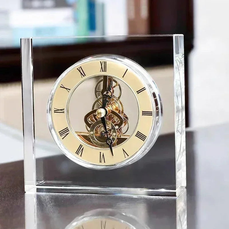 Crystal tabletop clock - Dunley showcasing visible brass gears in a clear acrylic frame with a cream Roman numeral face, embodying modern elegance for any mantel or desk.