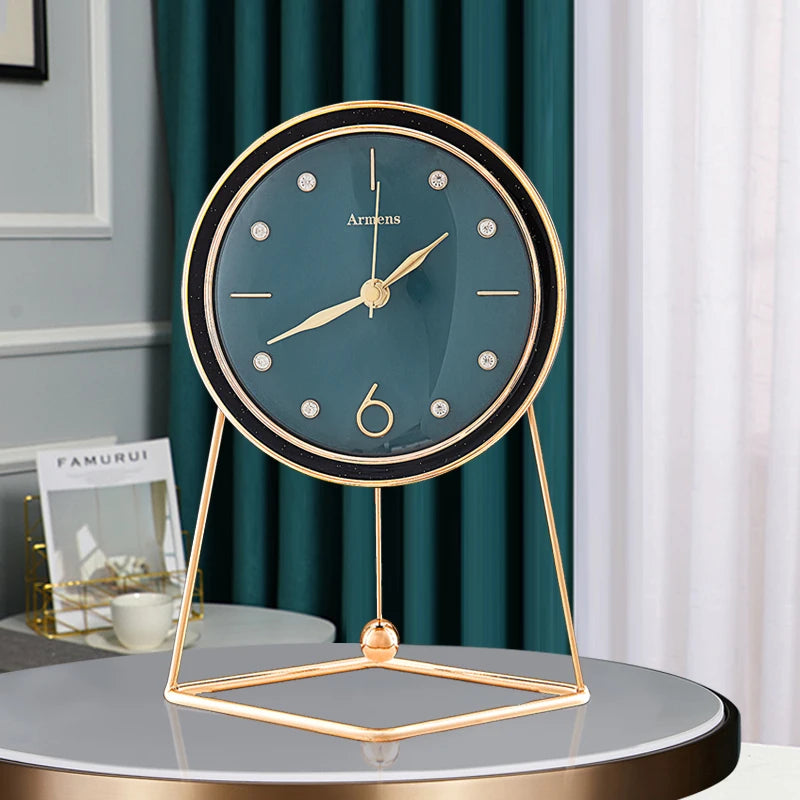 Dralen Pendulum Table Clock features a teal face with gold-tone accents and a geometric stand, capturing modern elegance with its open-concept design and rhythmic pendulum for stylish timekeeping.