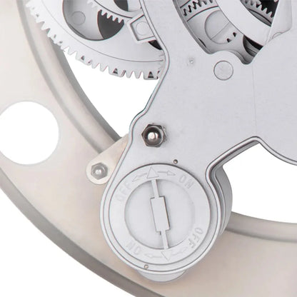 Modern Wall Clock Design - Elverton: Close-up of exposed mechanical gear train with manual ON ↔ OFF selector, resembling a quarter-turn valve actuator, integral to the clock's artistic and functional appeal.