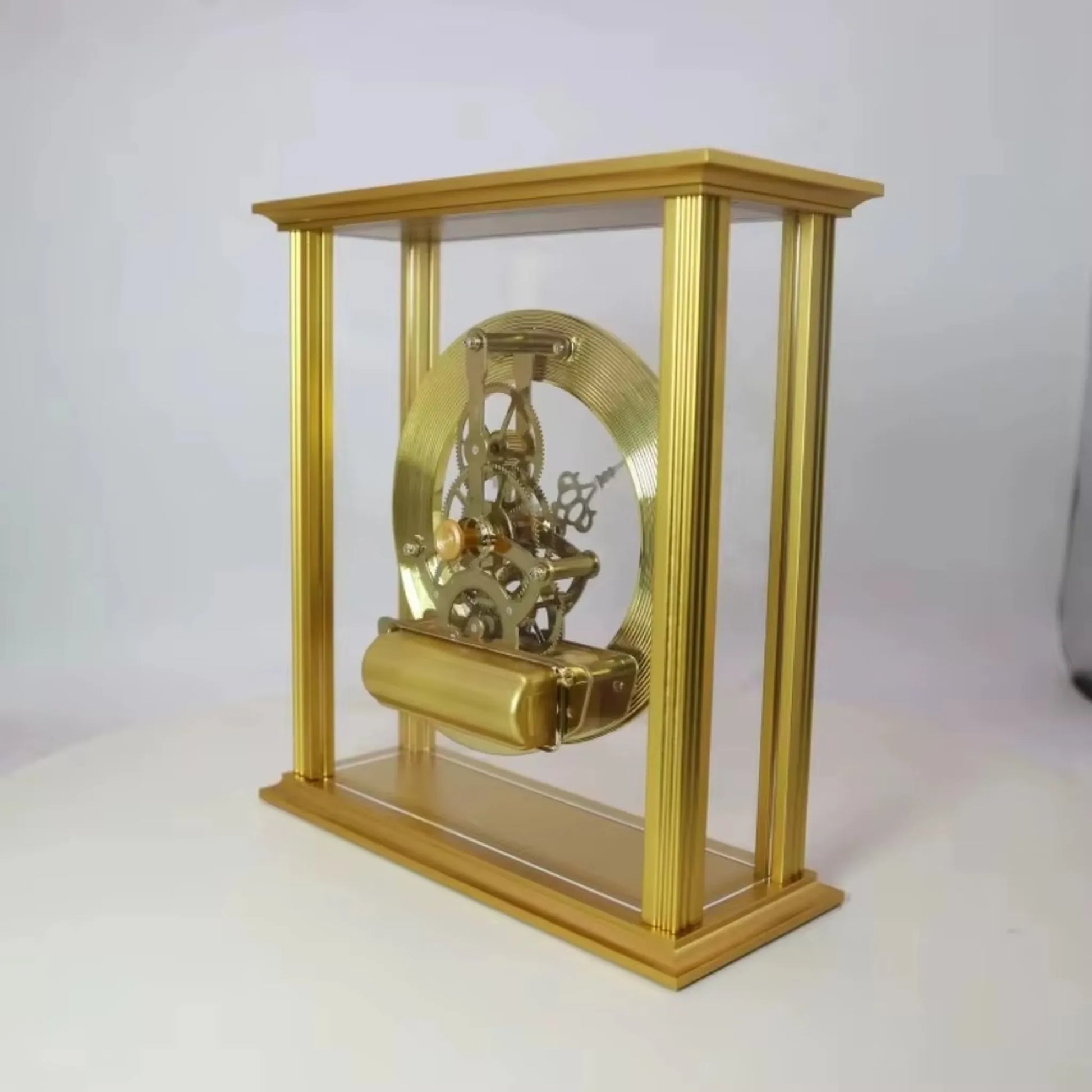 Brass table clock - Braven: A decorative skeleton clock showcasing visible gears and a polished brass finish, elegantly housed in a clear-sided frame, adding timeless sophistication to any desk or mantel.