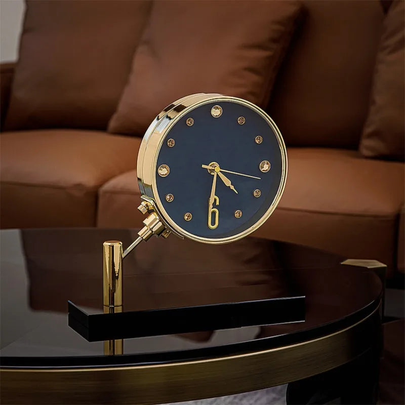 Luxury Table Clock - Corlen: A refined tabletop clock with a dark round face, gold hands, and polished gold housing on a metal stand, adding elegance to modern decor.