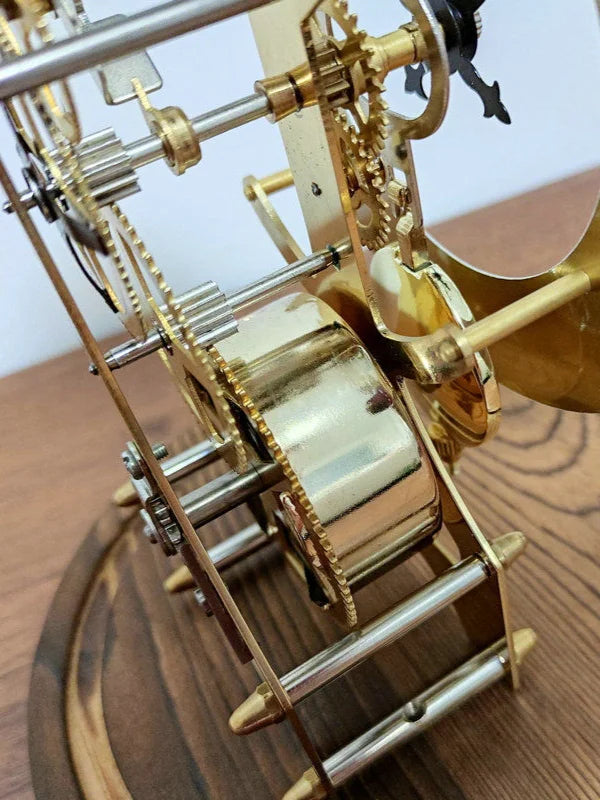 Glass dome clock - Stanley showcasing exposed movement with brass-and-steel framework, featuring a classic passing bell strike and rotating pendulum, perfect for adding vintage charm to any mantel.
