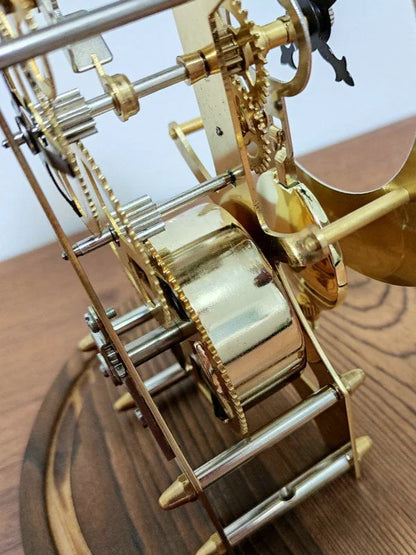 Glass dome clock - Stanley showcasing exposed movement with brass-and-steel framework, featuring a classic passing bell strike and rotating pendulum, perfect for adding vintage charm to any mantel.