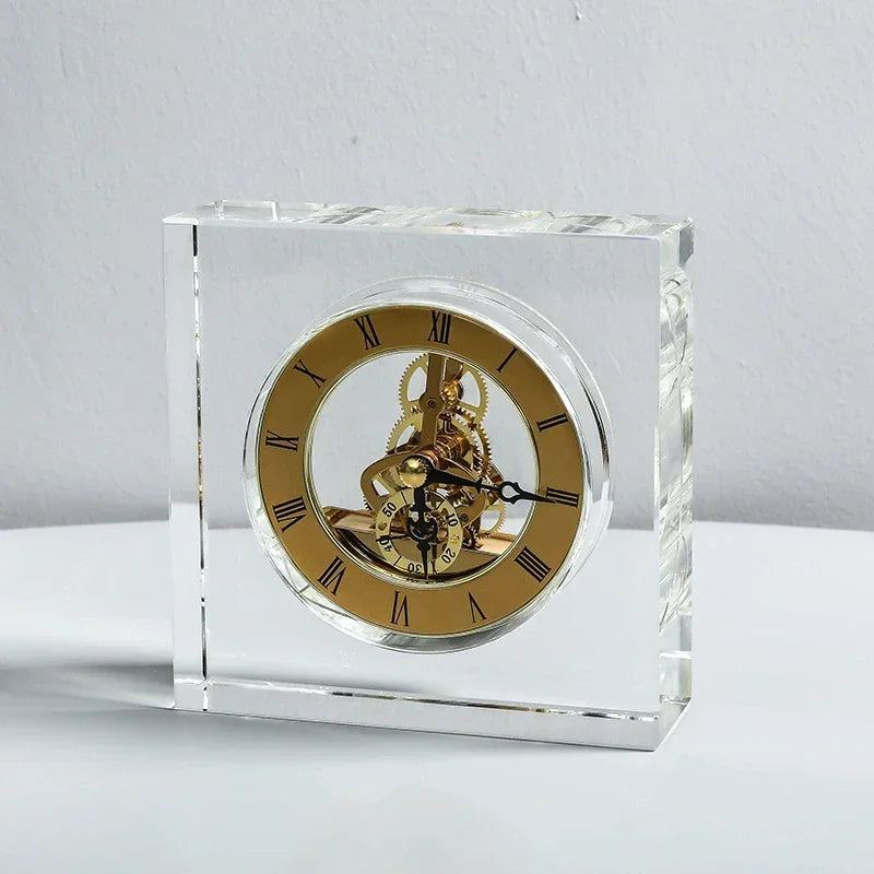 Crystal tabletop clock - Dunley: A clear glass-encased clock featuring a gold-tone skeleton dial with Roman numerals and visible brass gears, perfect for enhancing any desk or mantel with modern elegance.