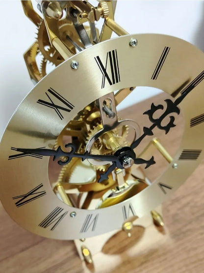 Glass dome clock - Stanley: Close-up of the brass dial with Roman numerals, ornate hands, and exposed gears, showcasing its classic passing bell strike movement under a glass dome, perfect for mantels.