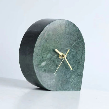Green marble desk clock displayed on white console with modern decor