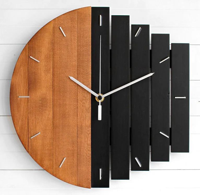 Modern wood wall clock - Clevor, featuring a semi-circular natural wood and black slatted design, with minimalist silver hands and metal hour markers, crafted from European linden wood for stylish spaces.