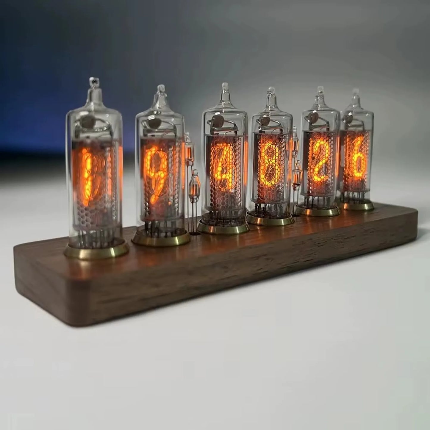 Nixie tube clock - Hartley: Six glowing IN-14 Nixie tubes display time on a sleek wooden base, blending vintage Soviet technology with modern design for a captivating desk or shelf accessory.