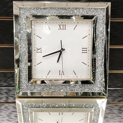 Fancy wall clock - Norwyn features a white face with Roman numerals, black hands, and a mirrored frame with crushed-glass accents, designed to be a room's elegant focal point.