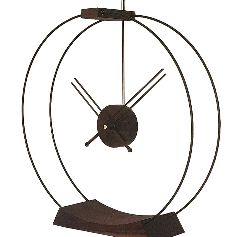 Design table clock - Bexley: A minimalist sculptural clock featuring two concentric metal hoops and spidery hands, creating an elegant, sophisticated statement piece that embodies contemporary style and essential timekeeping elements.