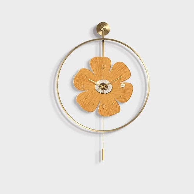 Flower wall clock - Fentin features a wooden petal design with integrated numerals, surrounded by a brass-finished frame, and includes a vertical rod with a cylindrical pendulum for a modern touch.