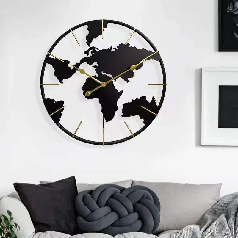 World Map Wall Clock - Claverton features a circular metal frame with continents in black silhouette and elegant gold hands, ideal for adding sophistication to any room.