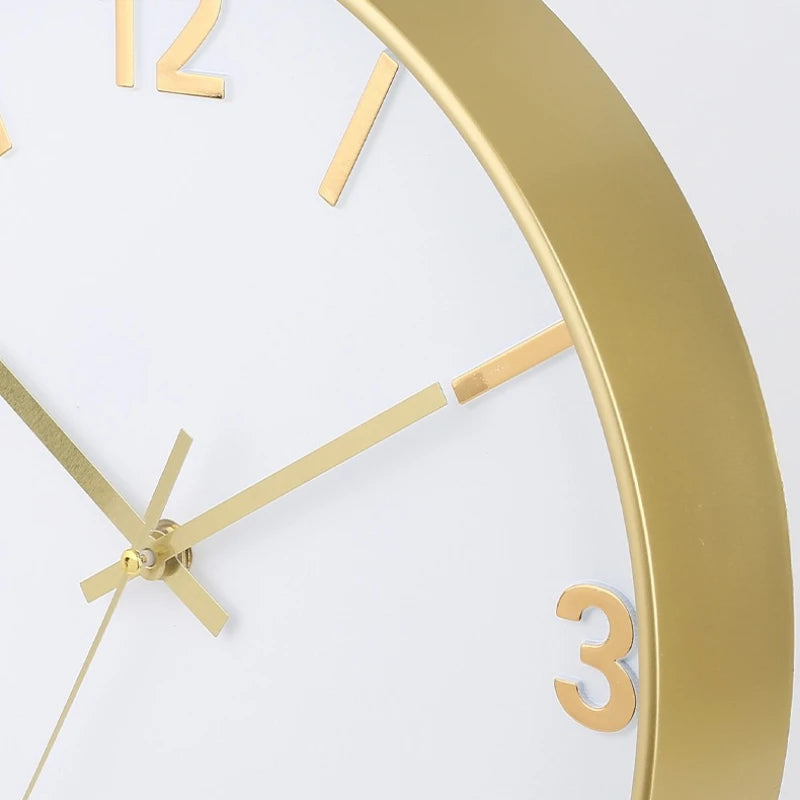 Modern Silent Wall Clock - Densford with a white face, gold hour markers, and slim gold hands, set in a gold-colored frame, exemplifying minimalist elegance with silent, non-ticking movement.