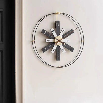Modern Lounge Wall Clocks - Fremton features twelve rectangular spokes with walnut-brown numerals, brass hands, and a sleek, openwork design, ideal for modern spaces from The Horologista.