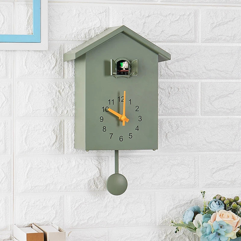 Wooden Cuckoo Clock - Brivon: A wall-mounted, house-shaped clock with black numerals, yellow hands, and a swinging bird pendulum, offering a modern twist on traditional design.