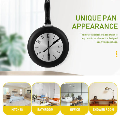 Frying Pan Wall Clock - Ashford: A novelty clock with a pan-shaped body, fork and knife hands, and a spatula icon at 6 o'clock, enhancing culinary charm in kitchens and more.