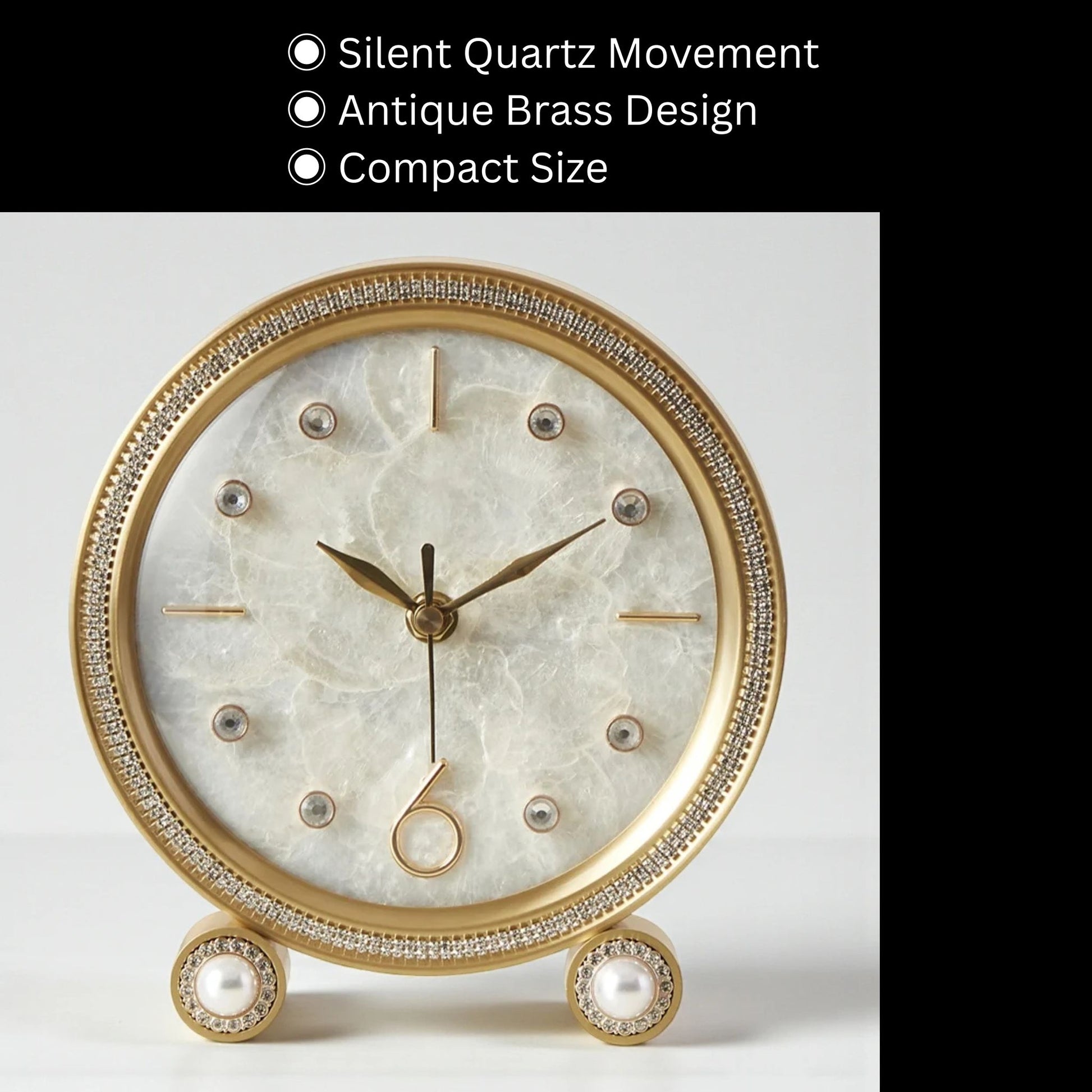 Silent Table Clock - Feynor with antique-brass finish, marble-style dial, crystal markers, brass hands, and crystal-inlaid bezel, showcasing elegance and silent quartz movement on matching brass feet with faux-pearl accents.