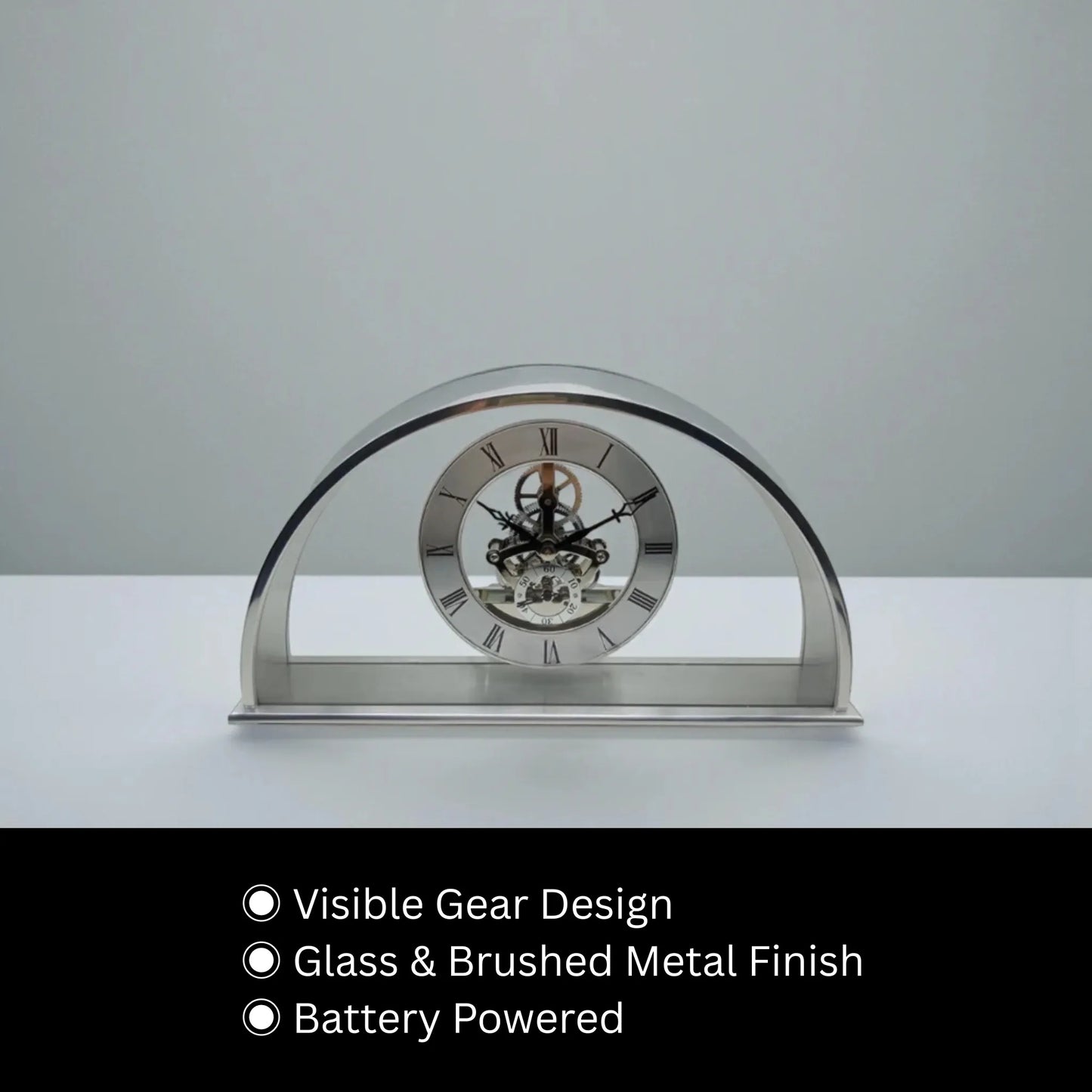 Crystal table clock - Cranley: A modern arch-shaped clock with visible gear mechanism in glass, encased in brushed metal, ideal for special occasions. Battery powered, combining elegance with functionality.