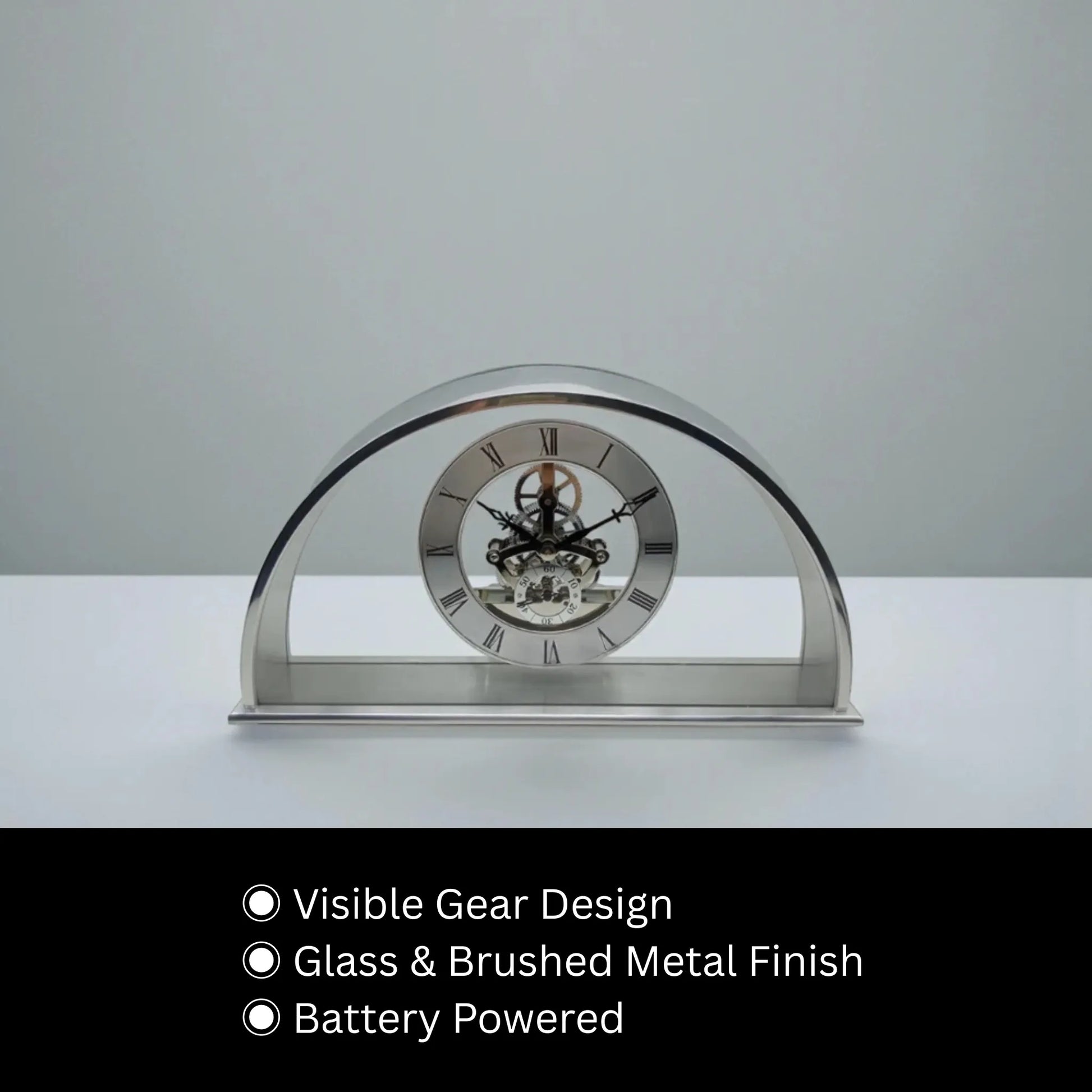 Crystal table clock - Cranley: A modern arch-shaped clock with visible gear mechanism in glass, encased in brushed metal, ideal for special occasions. Battery powered, combining elegance with functionality.