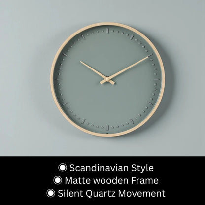 Small modern wall clock - Merrin: A minimalist Scandinavian-style design featuring a sage green face with raised hour dots, slim light-wood frame, and silent quartz movement, creating a serene focal point for any room.