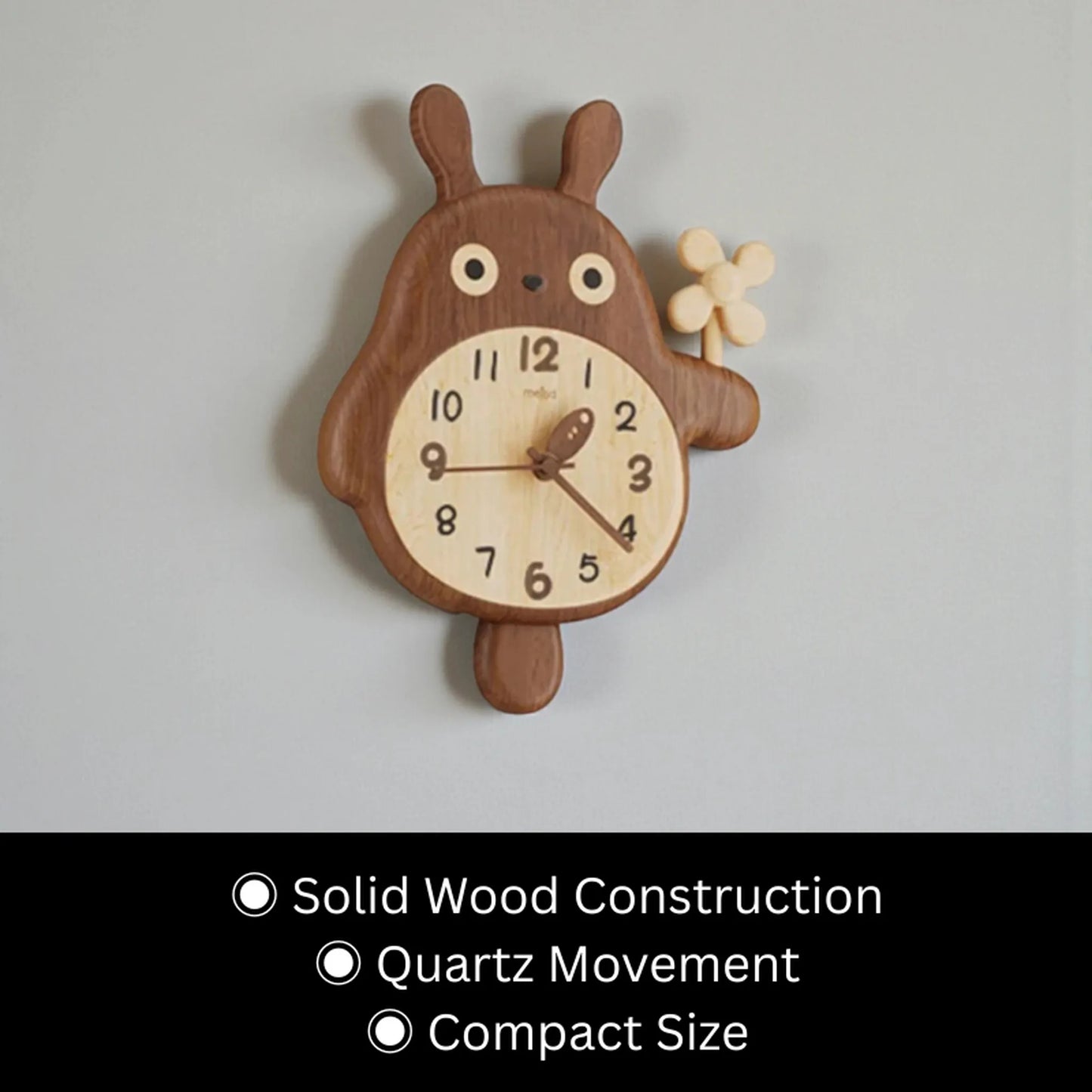Small decorative wall clocks - Veynor A wooden, rabbit-shaped clock with a pinwheel, featuring a lighter-toned clock face with Arabic numerals and branch-like hands, showcasing solid wood craftsmanship and quartz movement.