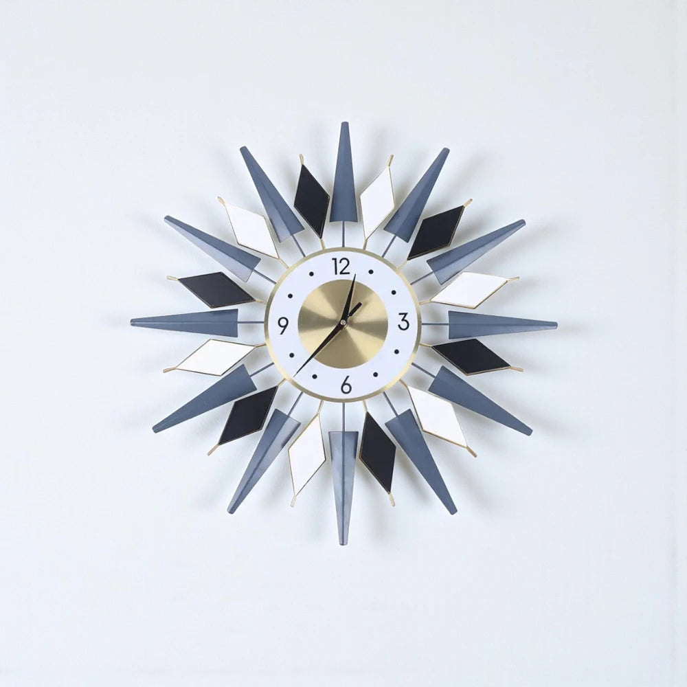 Big Decorative Wall Clocks - Denley features a striking design with three-dimensional spikes and diamond shapes, centered around a round analog face, embodying mid-century modern elegance.