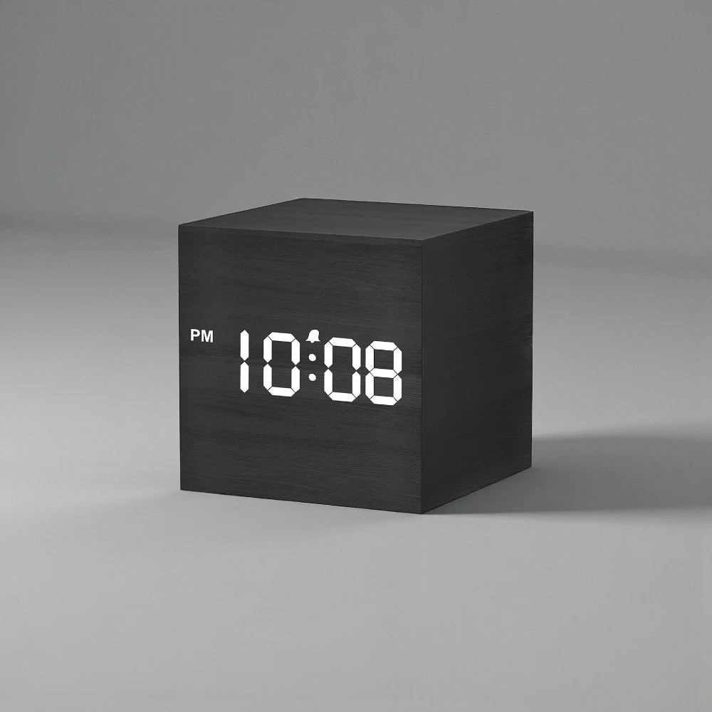 Cube Alarm Clock - Corven: A sleek, wood-textured digital clock displaying 10:08 PM with a clear LED screen, perfect for modern bedside tables.