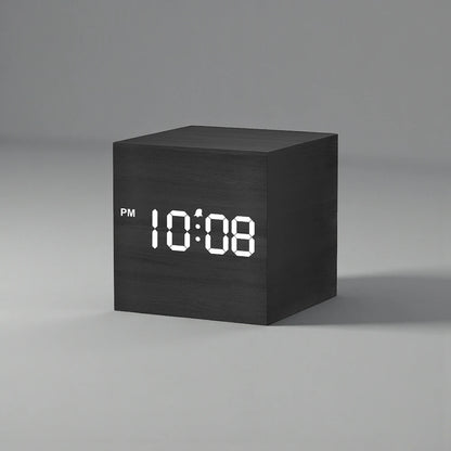 Cube Alarm Clock - Corven: A sleek, wood-textured digital clock displaying 10:08 PM with a clear LED screen, perfect for modern bedside tables.