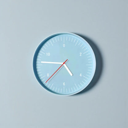 Numbers wall clock - Dunmore with a pale blue face features bold hour markings at 2-hour intervals and chunky white hands, ideal for a minimalist, modern home from The Horologista.