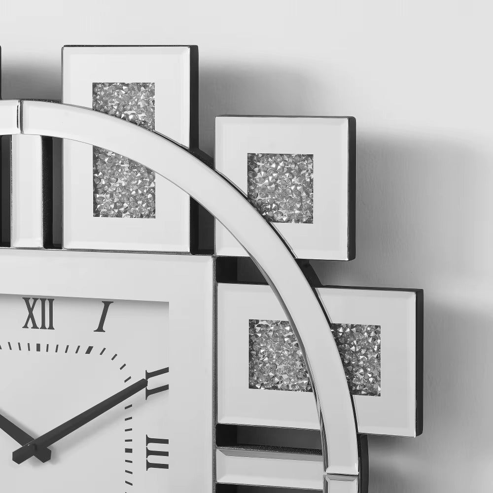 Decorative mirror wall clock - Stratton features a square face with Roman numerals, black hands, and a shiny silver ring, adorned with mirrored panels and crushed diamond inlay for a modern, glamorous look.