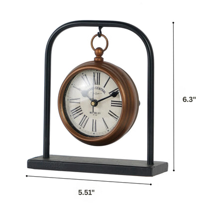 Retro Table Clock - Kelros: A small, charming tabletop clock styled as a vintage pocket-watch, featuring Roman numerals on a round face, suspended from a black metal arch with a stable rectangular base.