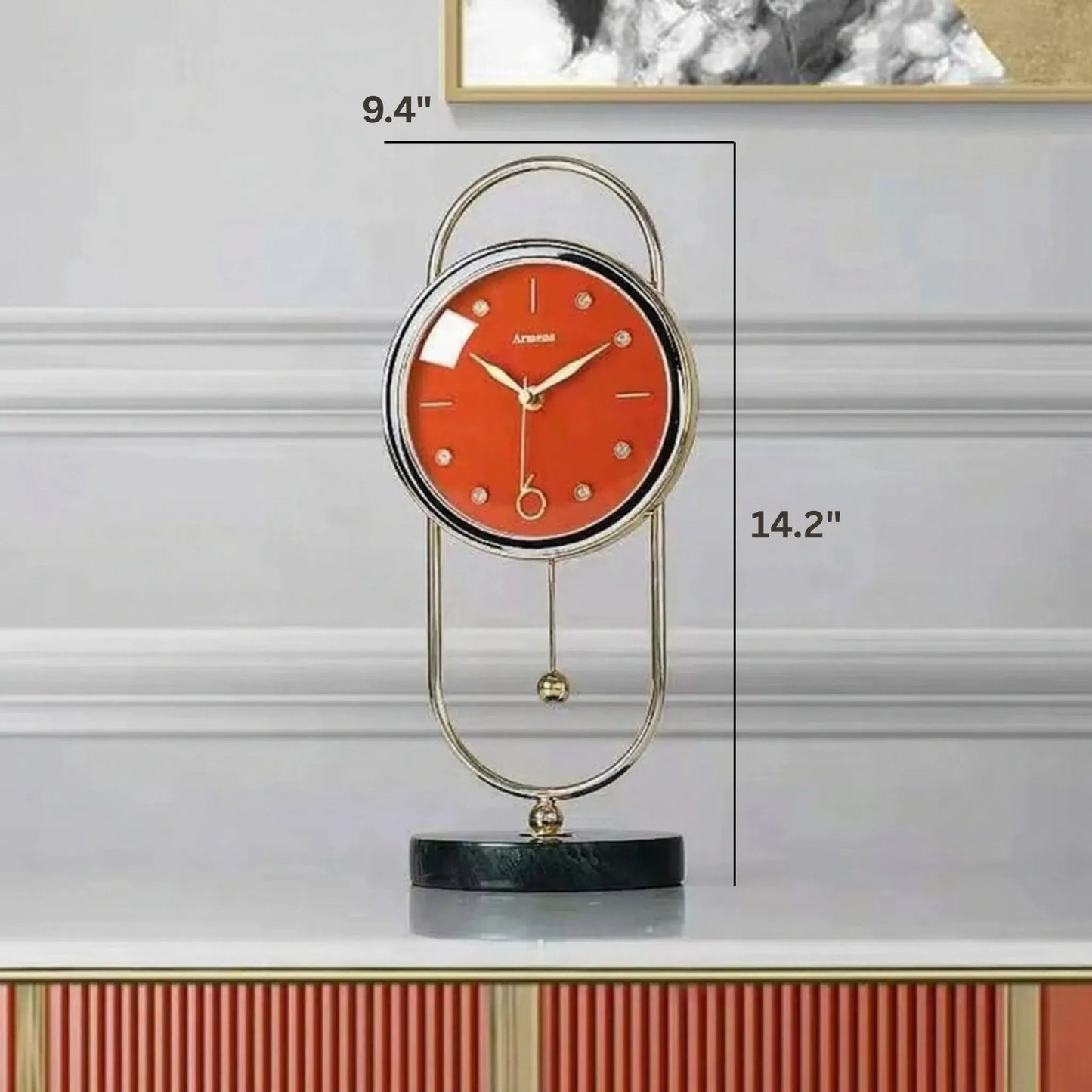 Pendulum Table Clock - Leiton: A modern clock with a bold red face, brushed-gold frame, U-shaped stand, and swinging pendulum, set on a marble base, offering dynamic elegance for desk or mantel.