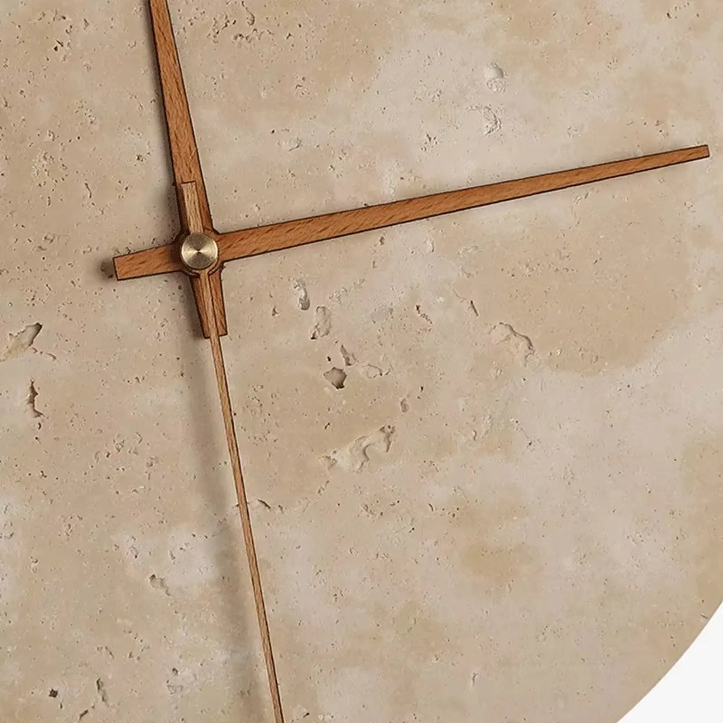 Modern wall clock for living room - Torwyn features a 9-inch travertine face with wooden hands and a warm LED halo, highlighting its minimalist design and unique natural textures.