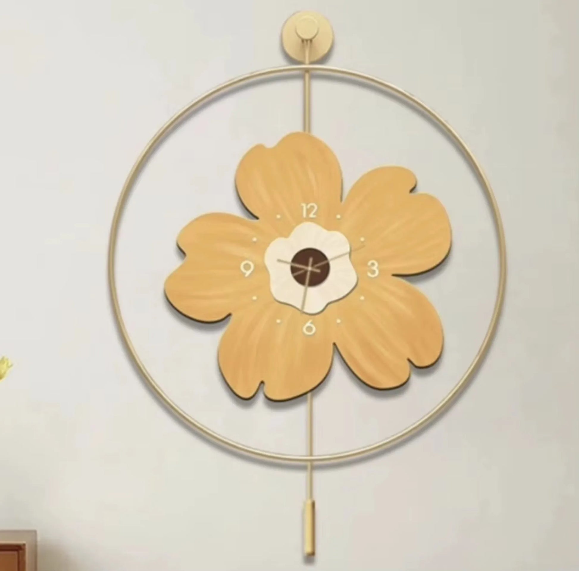 Flower wall clock - Fenton: A decorative wall clock with a flower-shaped face featuring numbers on petals, set in a thin circular frame, and adorned with a small pendulum for added charm.