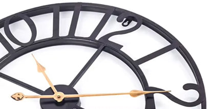 Oversized Wall Clock - Alderton features a black metal skeleton-style frame with cut-out numerals, gold-colored hands, and visible moving gears, highlighting its exposed 3D mechanism for a striking visual appeal.