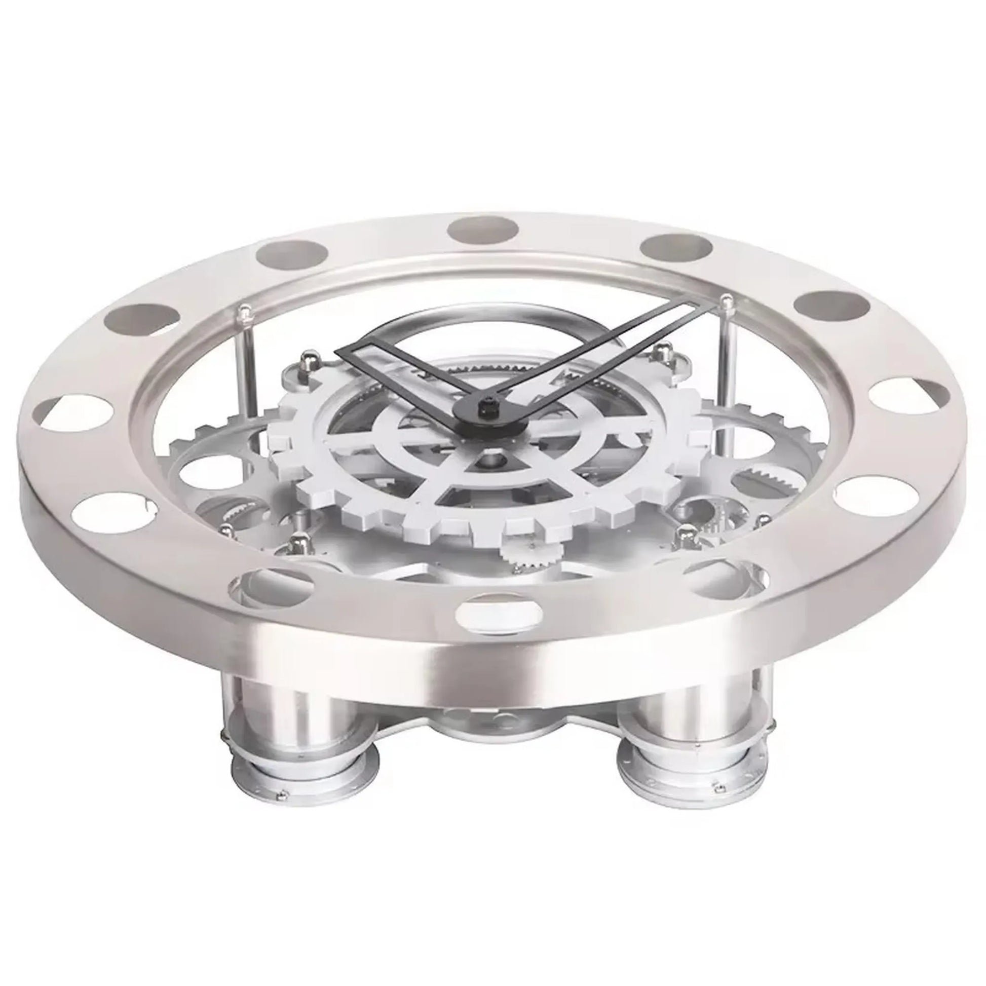 Modern Wall Clock Design - Elverton: A tabletop skeleton clock featuring a stainless-steel bezel with cut-outs, exposed interlocking gears, and black metal hands, elevated on short metal legs for a striking mechanical display.