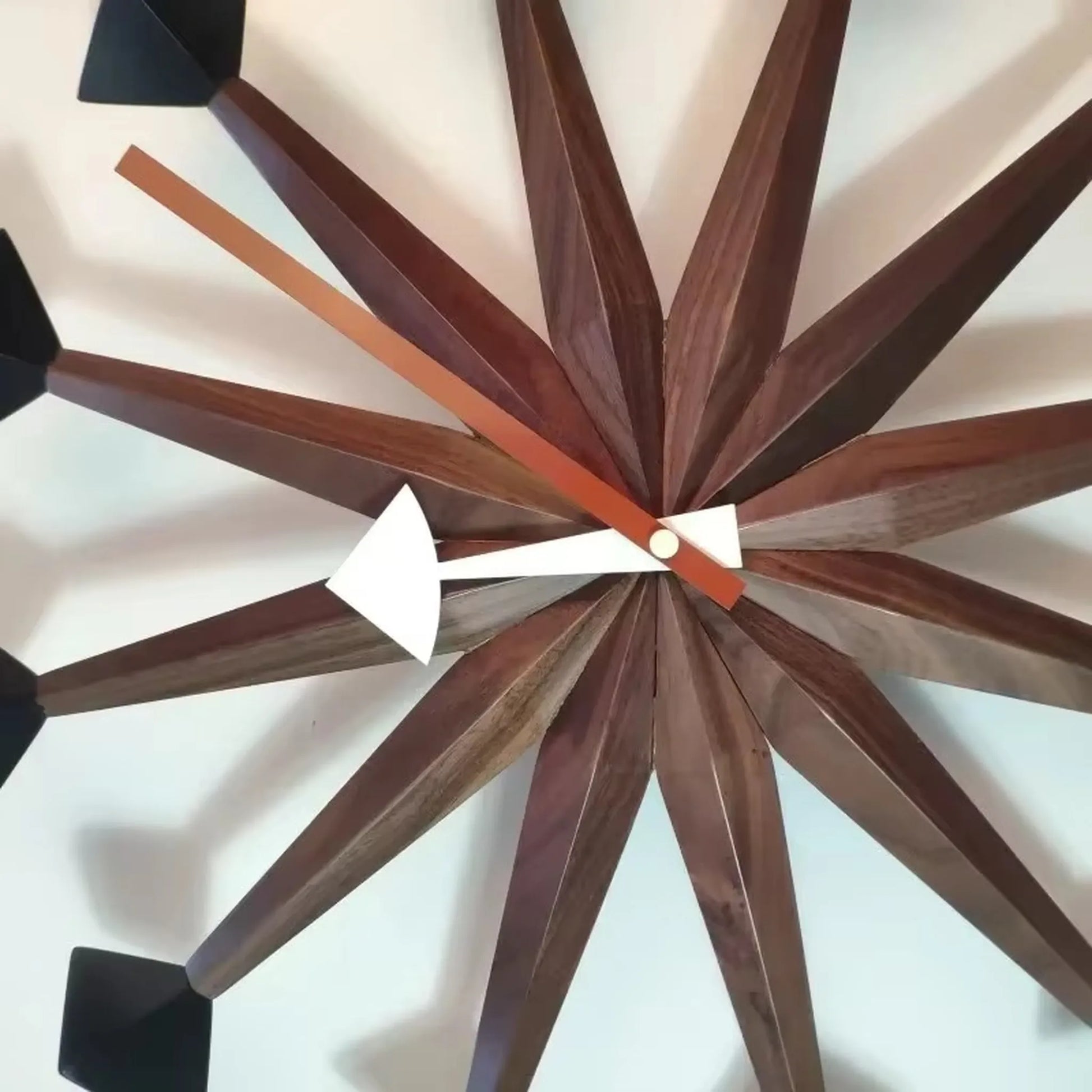 Decorative wall clocks modern - Drayen features a mid-century design with wooden rays and contrasting hour and minute hands