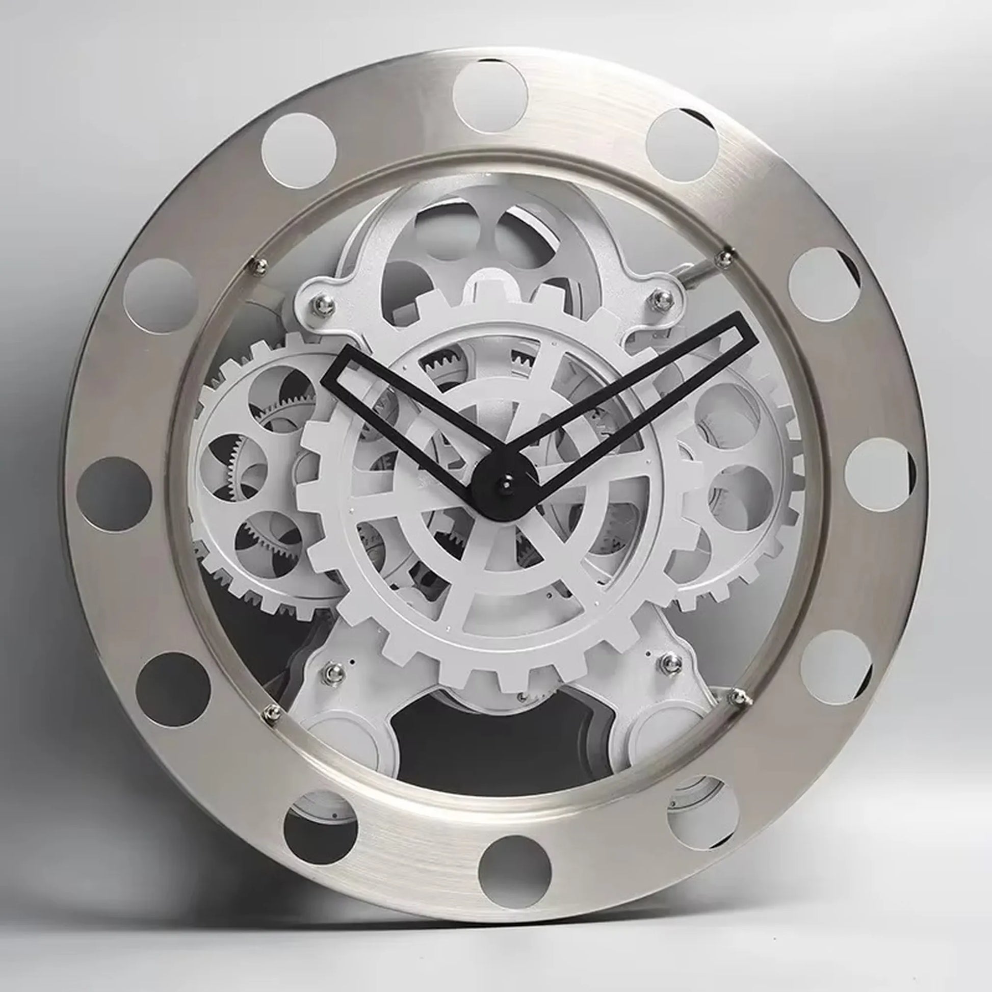 Modern Wall Clock Design - Elverton showcases exposed white gears and black hands, framed by a riveted gun-metal trim, transforming your wall into a silent, mechanical sculpture.