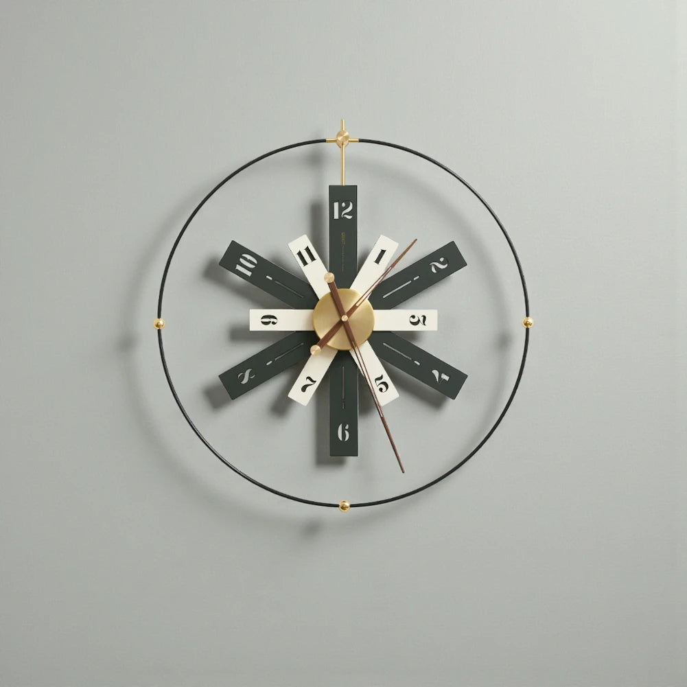 Modern Lounge Wall Clocks - Fremton: A minimalist wall clock featuring a black metal ring with gold spheres, alternating black and off-white blades, and warm metallic hands for a mid-century design.